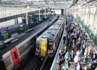 Passengers disembark at Waverley on a bright and sunny 5 October 2017. The train is the  0829 Ayr - Edinburgh, which has arrived here via Glasgow Central and Carstairs. Standing alongside at platform 19 is CrossCountry Trains ultimate long distance service, the 0820 Aberdeen – Penzance. <br><br>[John Furnevel 05/10/2017]
