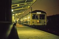 On Sunday 14th November 1976 at around 21.00, the last return trip of the day to Sudbury is about to head off into the night from platform 6 at Colchester.<br><br>[Mark Dufton 14/11/1976]
