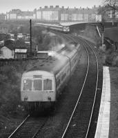 101 317 passes Meadowbank Stadium Halt on the Abbeyhill Loop as a HST approaches. Services diverted for ECML electrification in 1987.<br>
<br>
<br><br>[Bill Roberton //1987]
