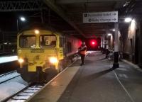 'Get a move on!' Freightliner 66518 gets a fresh driver as it pauses in Platform 1 with a train from Southampton MCT to Hams Hall Parsec.<br><br>[Ken Strachan 11/12/2017]