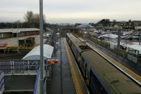 Looking west from the footbridge at Bathgate on 19th December 2017 as a Milngavie<br>
service is about to depart. The depot is on the left.<br>
<br>
<br><br>[David Panton 19/12/2017]