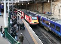 The Virgin Trains East Coast 0755 ex-Inverness <I>Highland Chieftain</I> running into platform 2 at Waverley on 21 December 2017. Standing alongside at the east end of platform 1 is the 1142 ScotRail service to North Berwick. <br><br>[John Furnevel 21/12/2017]