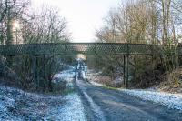 Around a mile south of Hassendean station is this extremely long footbridge at Hassendeanburn Farm. The view looks south from the infilled cutting. [Ref query 2 January 2018]<br><br>[Ewan Crawford 27/12/2017]