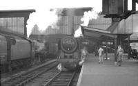 A recent arrival stands at Carlisle platform 3 in the summer of 1960 behind Britannia Pacific 70044 <I>Earl Haig</I>.<br><br>[K A Gray //1960]