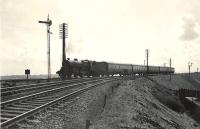 Looking south east towards Byrehill Junction on 4 April 1959 as <I>Crab</I> 2-6-0 42808 takes the route north towards Kilwinning with a train from Ayr to Glasgow St Enoch. <br><br>[G H Robin collection by courtesy of the Mitchell Library, Glasgow 04/04/1959]