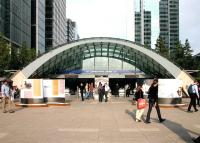 Entrance to Canary Wharf station on the London Underground Jubilee Line extension, opened in 1999. View east on a pleasant summer afternoon in July 2005, with the former West India Dock behind the camera. [See image 5217]<br><br>[John Furnevel 22/07/2005]