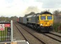 The driver of this Southbound freight had to take it easy around the curve in the background, but now has the hammer down, as I believe those American truck driver chappies say. Loco is Freightliner 66570, looking towards Nuneaton. [Ref query 11 January 2018] <br><br>[Ken Strachan 08/04/2016]