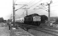 40028, formerly <I>Samaria</I>, heads south at Garstang & Catterall with the ICI soda ash tanks from Corkickle to Northwich on 11th October 1980. At the time these cream coloured tank trains were one of the most distinctive freight movements on the northern WCML.  <br><br>[Mark Bartlett 11/10/1980]