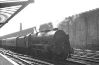 Royal Scot 4-6-0 46128 <I>The Lovat Scouts</I> stands in the west sidings alongside Carlisle platform 1 on a bright and sunny 31 August 1964 with the 10.30am Perth parcels.<br><br>[K A Gray 31/08/1964]