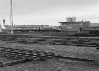 A 3-car Derby DMU passes Slateford Junction signalbox in 1982.  In the foreground is the civil engineers yard.  The 'box had closed the previous year but was retained as a training centre.<br>
<br><br>[Bill Roberton //1982]