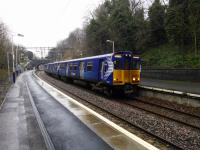 A Newton to Glasgow 314 EMU service calls at Kirkhill on the wet Saurday afternoon<br>
of 13th January 2018. I think Kirkhill can be considered the posh end of<br>
Cambuslang.<br>
<br>
<br><br>[David Panton 13/01/2018]
