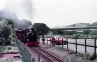 Festiniog Railway 0-4-0STT <I>Linda</I> sets out on the climb from Boston Lodge in 1982. Alongside in the lay-by is my never forgotten 1976 Vauxhall Cavalier Coupe. <br><br>[Mark Bartlett //1982]