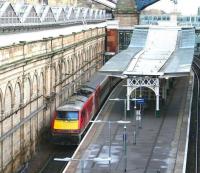 View east from Waverley Bridge over the sub platforms on 21 December 2017. Recently arrived at platform 9 is the Virgin Trains East Coast 0645 ex-Kings Cross. Note the way train and platform start to curve to the right to avoid the pier supporting the North Bridge.<br><br>[John Furnevel 21/12/2017]