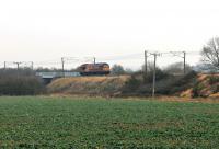 DB 67030 heads north light engine along the ECML on 26th January 2018. The locomotive has just passed the former Barkston South Junction, where the chord to the Skegness line branched off until 2005. It is just about to cross the Skegness to Nottingham line on the bridge shown. Trains from Skegness to Grantham now also run this way using the new Allington Chord. [Ref query 31 January 2018]  <br><br>[Mark Bartlett 26/01/2018]