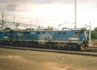 Electric locomotive E7005 and a companion awaiting their next duties in sidings outside Jo'burg. Although I saw diesels with TOP-type class numbers, these were numbered corresponding to our pre-TOPS system. [see image 55269].<br><br>[Ken Strachan 05/11/2005]
