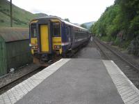 A southbound service departs from Arrochar and Tarbet on 28 May 2007 heading for Glen Douglas and the next station stop at Garelochhead.<br><br>[John McIntyre 28/05/2007]