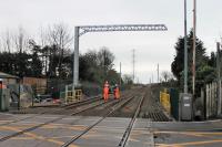 Some cabling work taking place at Carleton Crossing on 10th February 2018. This view looks toward Layton and Blackpool with a Class 66 hauled engineers train seen standing on the Up Line. The signal box stood on the left [See image  23697] for an earlier view.<br><br>[Mark Bartlett 10/02/2018]