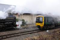 70013 <I>Oliver Cromwell</I> passes a GWR lower quadrant signal, and DMU 165108, as it leaves Moreton-in-Marsh on 10th February 2018.<br>
<br>
<br><br>[Peter Todd 10/02/2018]