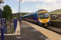 TPE 185118 passes Stalybridge on 05 July 2014 with a service to Manchester Airport from the east of the Pennines.<br><br>[John McIntyre 05/07/2014]