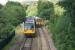 A pair of Pacers on a Manchester to Blackburn service via Todmorden pass a Class 158 on a Blackpool to York service at Stansfield Hall Jct at the south end of the Copy Pit line on 17 August 2017. The actual junction is behind the photographer however there is a facing crossover between the two trains to give southbound access to the single line Todmorden Curve.<br><br>[John McIntyre 17/08/2017]