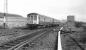 Carlisle bound Derby DMU passing Busby Junction in 1974. The unit is a Carlisle based set, with bars over the drop lights for working over the Cumbrian Coast line with its restricted clearances. The signal box at Busby Junction had been recently decommissioned. <br>
<br><br>[Ian Millar //1974]