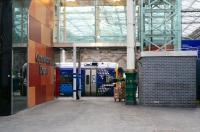 A quiet corner of Waverley station on 21 December 2017. View is south past the attractively clad entrance to the ops depot towards platform 4, where the 1124 service to Tweedbank is at the platform. Spot the individual trying to hide somewhere in the picture.<br><br>[John Furnevel 21/12/2017]