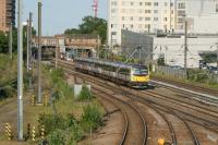 360202 crosses West Ealing Jct whilst working from Paddington to Heathrow Airport on 04 June 2011.<br><br>[John McIntyre 04/06/2011]