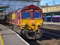 DBS 66111 passes Platform 3 at Carlisle Citadel with a ballast from Kingmoor to Tyne Yard on 21st February 2018.<br>
<br>
<br><br>[Bill Roberton 21/02/2018]