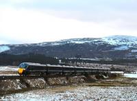 GWR liveried Hitachi Class 800 Azuma, No. 800303 forms the 5X71 ECS working from Craigentinny to Inverness crossing the freezing cold moor at Moy on 27th February 2018. (Strictly as GWR, this is a InterCity Express Train (IET) rather than Azuma - thank you WC.)<br>
<br>
<br><br>[John Gray 27/02/2018]