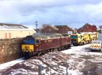 WCRC 57316 and a track machine stabled in the up siding behind Arbroath signal box on 28 February 2018.<br><br>[Sandy Steele 28/02/2018]