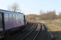 A Northern Class 144 Pacer, possibly in its last year of service, leans on the sharp curve as it waits to depart from Clapham with a Leeds to Morecambe service in February 2018. The silver birch trees directly ahead sit on the trackbed of the old line through Ingleton to Low Gill on the WCML, which lost its local services in 1954 but only closed completely in 1966. <br><br>[Mark Bartlett 24/02/2018]