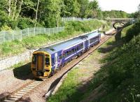 A fine May morning in 2016 sees 158727 run through the abandoned platforms of the original Eskbank station with a northbound train on the Borders Railway. <br><br>[John Furnevel 22/05/2016]