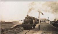 Another photo taken around the time of the opening of Knott End station in 1908, the year the line was extended from Pilling through Preesall. The loco is the <br>
0-6-0T <I>Knott End</I>, which had been purchased for this extension of the line. In this view looking back to the station the Wyre Estuary is on the left. <br><br>[Knott End Collection //1908]