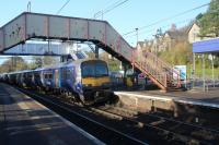 320305 approching Westerton with a Dalmuir to Larkhall service on 2nd November 2017. How long will the footbridge last after the new lifts and stairs are completed?<br>
<br>
<br><br>[Alastair McLellan 02/11/2017]