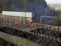 The old Muirside Road overbridge at Baillieston station being cut up <i>in situ</i>. The road is due to reopen in September 2018. <br><br>[Colin McDonald 11/03/2018]