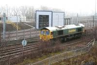 The 0931 Millerhill SS - Leuchars ballast train crawls past the washing plant at Millerhill EMU depot  shortly after commencing its journey on 11 March 2018. The locomotive is Freightliner 66547. <br><br>[John Furnevel 11/03/2018]