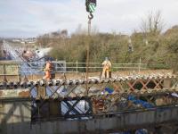 Piece by piece removal of the old Muirhead Road overbridge in progress in mid March 2018. As the demolition proceeds southwards, sections of the supports for the new bridge are being installed from the north side.<br><br>[Colin McDonald //]