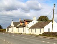 The abandoned former stagecoach inn close to Forrestfield station (1862-1930) standing alongside the A89 between Airdrie and Bathgate. Seen here on a sunny May morning in 2010 boarded up awaiting demolition. <br><br>[John Furnevel 02/05/2010]