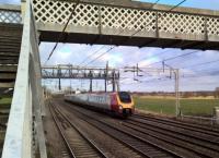 A Voyager service from Chester to London approaches a crudely modernised footbridge to the south of Polesworth in February 2018.<br><br>[Ken Strachan 01/02/2018]