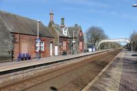 Aspatria station, seen on a sunny 9th March 2018 looking towards Carlisle. The station building is in private use and this is a request stop nowadays.  <br><br>[Mark Bartlett 09/03/2018]