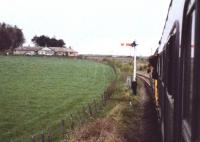 The 'Last Train to Brechin' railtour held at the outer home signal for Kinnaber Junction. It had to reverse and cross over to the Up Main to continue its journey south. [Ref query 24 March 2018]<br><br>[Charlie Niven 02/05/1981]