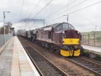 37518 leads 44871 and 45407 westwards through Gartcosh station with a stock movement from Carnforth to Fort William.<br><br>[Ian Millar 28/03/2018]