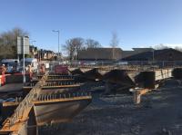 Sections of the steelwork of the new overbridge at Baillieston lie ready to be assembled (and eventually painted, hopes at least one idle spectator).   <br><br>[Colin McDonald 19/03/2018]