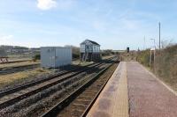 The signal box at Maryport is still quite busy as all Whitehaven direction trains have to cross over to the platform road and then cross back again to continue. There is also through line for freight and charters and a goods loop. The former lines to the docks curved right just beyond the modern bridge. 9th March 2018.<br><br>[Mark Bartlett 09/03/2018]