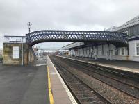 The lattice footbridge from platforms 6–9 which Network Rail plans to replace with a fully accessible structure. The new bridge will also permit electrification of these platforms. The photo was taken during a 4 week closure of the Stirling–Alloa line for engineering works.<br><br>[Colin McDonald 23/03/2018]