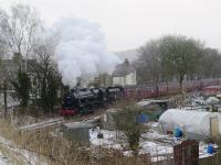 Unfortunately strong biting winds and frequent snow showers deterred allotment holders from tending their plots adjacent to the Hindlow Branch in Buxton on 17th March 2018 and so they missed the spectacle of a steam hauled passenger train to distract them from their labours.  With 45407 (running as 45157) leading and 45690 at the rear the train climbs the 1 in 60 gradient. <br><br>[Malcolm Chattwood 17/03/2018]
