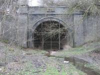 The southern portal of Catesby Tunnel on the former GCR, looking in less than perfect condition 110 years after the date carved in the stone at the top of the arch, 1897.<br><br>[John McIntyre 23/03/2007]
