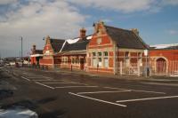 Outside view of the former Barry Island station building. It is all locked up for the winter but there are signs for a station cafe.<br><br>[Alastair McLellan 19/03/2018]