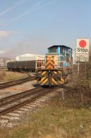 Tata Steel loco No 921 waits to enter Margam Knuckle Yard with some covered coil wagons on 21st March 2018.<br>
<br><br>[Alastair McLellan 21/03/2018]