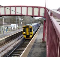 A Glasgow service halts at Curriehill on 28th March 2018. It might have been a better marketing move to give this station its original name of Currie when it reopened in 1987, rather than its last name. After all the other Currie, on the branch, had closed 44 years earlier and it's unlikely anyone would confuse them.<br><br>[David Panton 28/03/2018]